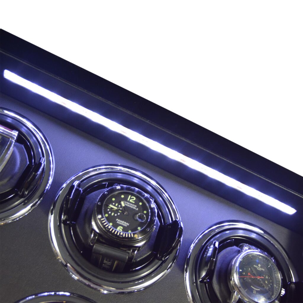 9 watch winder interior with LED light illuminating the upper winding positions