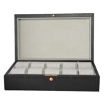 Watch box with metal snap button closure detail on PU leather exterior