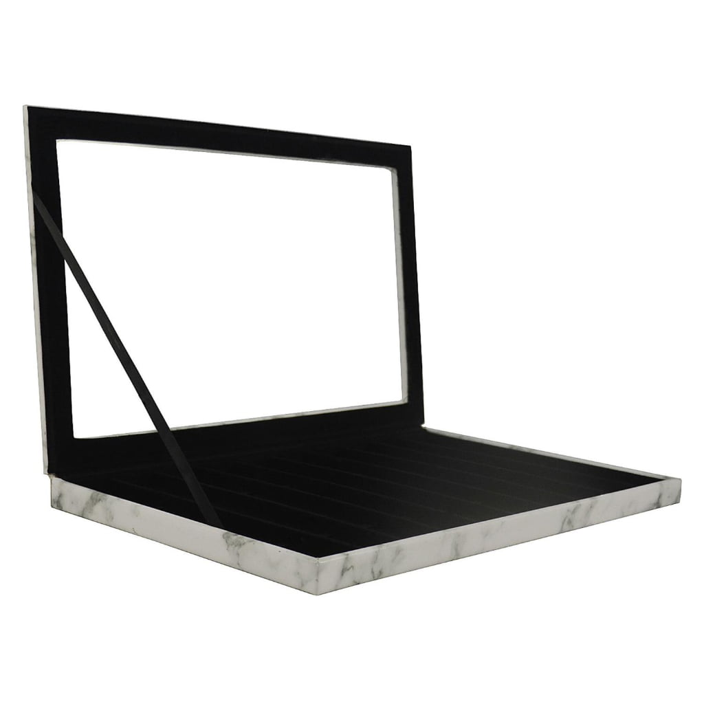 Open marble watch display case showing black velvet watch compartments