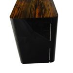 Watch winder side view showing high-gloss black cabinet, zebra stripe top and metal hinges