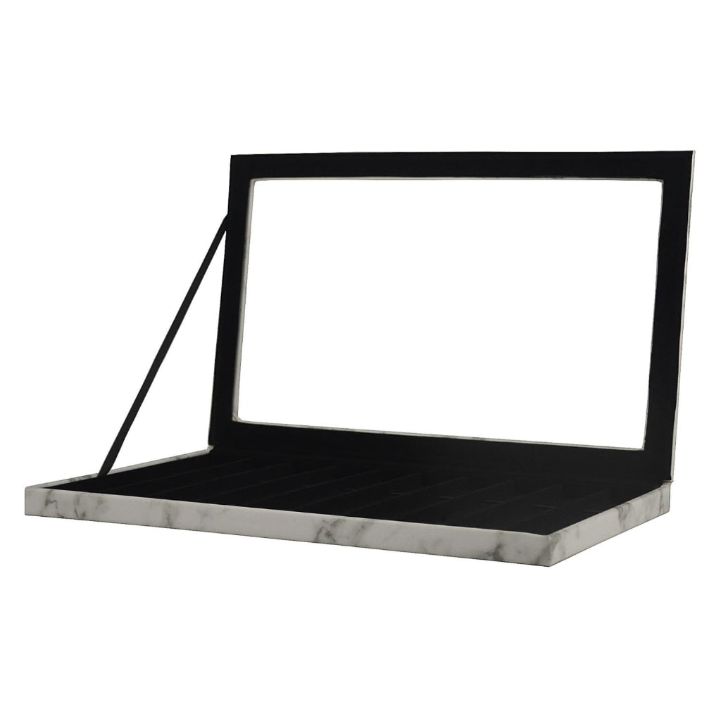 Black velvet interior of marble white watch display case