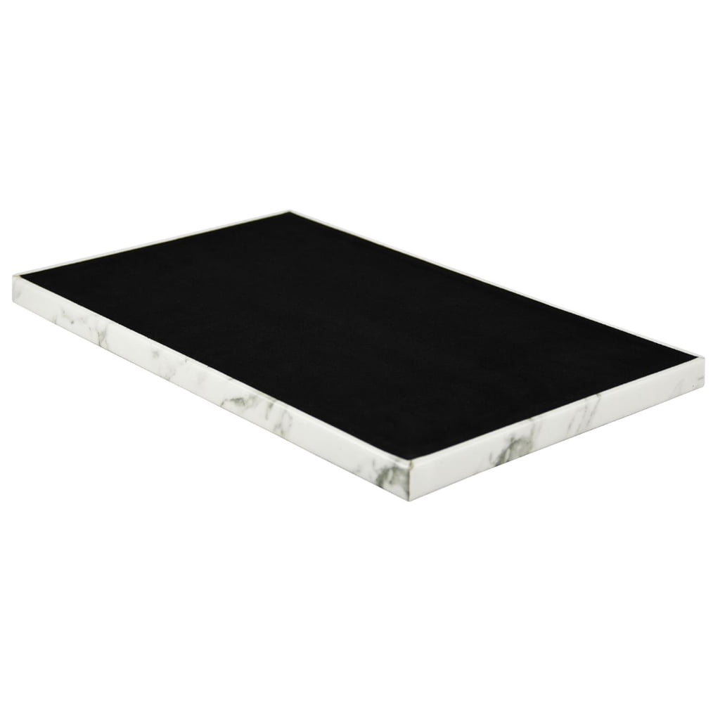 White marble watch strap storage tray with black interior surface