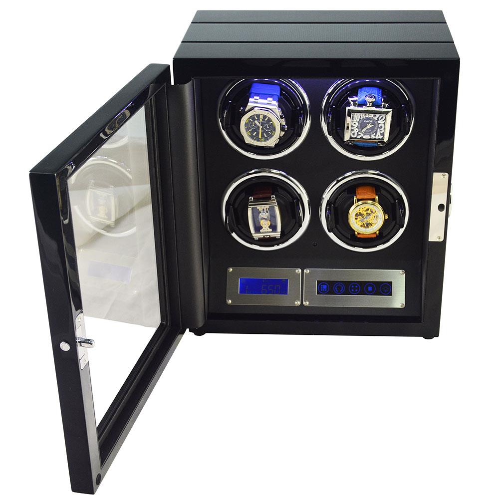 Open 4 watch winder with four watches, black interior and illuminated touchscreen controls