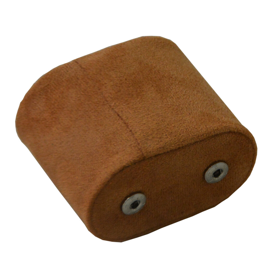 Brown velvet watch cushion showing two snap button fasteners