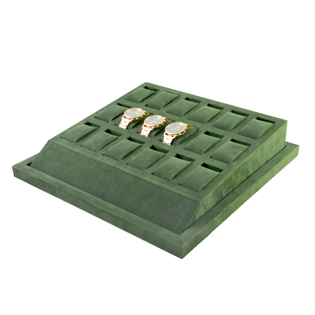 Green velvet watch tray with three watches displayed