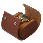 Open brown PU leather watch travel box holding one watch on the cushion
