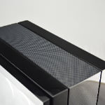 Close-up of carbon fiber exterior detail on high-gloss 6 watch winder cabinet