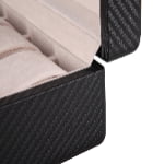 Carbon fiber watch case corner detail with beige velvet interior