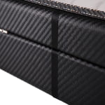 Black carbon fiber watch case exterior showing rear finish and trim detail
