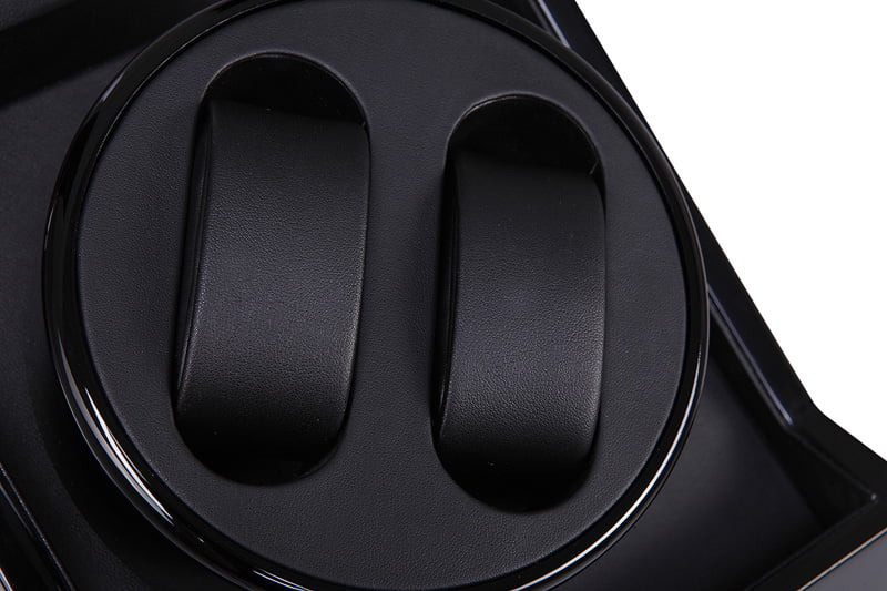 Black watch winder interior with two watch cushions