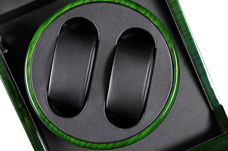 Green watch winder interior with black watch cushions