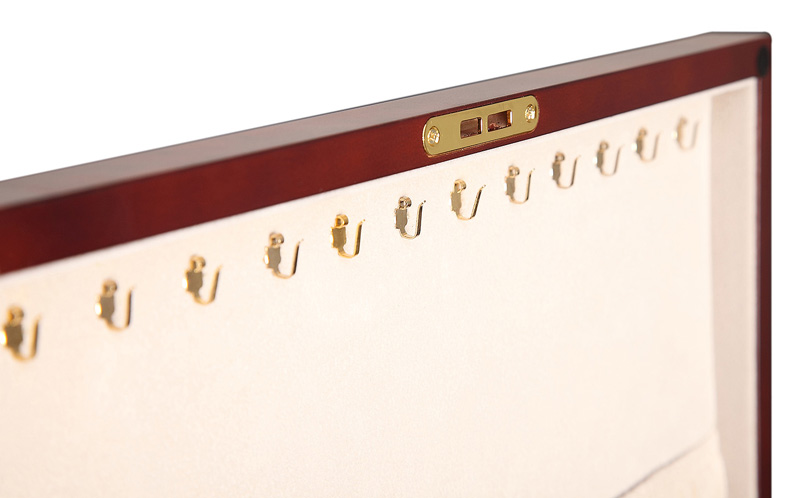 Wooden jewelry box interior with necklace hook panel and velvet lining