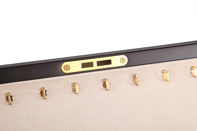 Matte black jewelry box close-up showing hardware lock detail