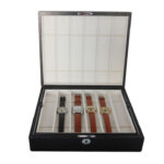 Black leather watch strap storage box with organized interior layout