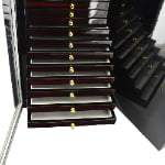 72-slot watch strap display cabinet with ebony finish and beige interior compartments