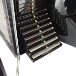 Large watch strap storage cabinet with multiple drawers and divided strap display sections