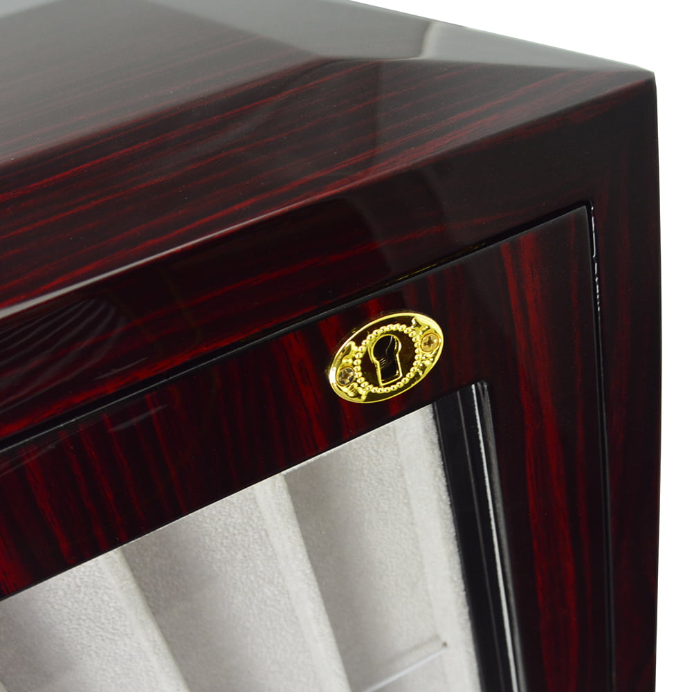 High-gloss ebony watch strap cabinet close-up with gold-tone hardware lock and beige interior