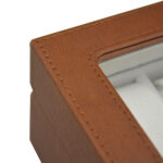 Brown leather watch box with acrylic display window and velvet wrapped interior