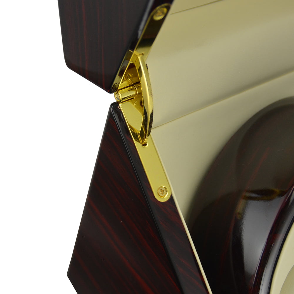 Ebony watch winder close-up showing gold-tone lid hinge, beige interior and high-gloss exterior finish