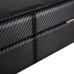 Close-up of black carbon fiber finish on watch storage case exterior