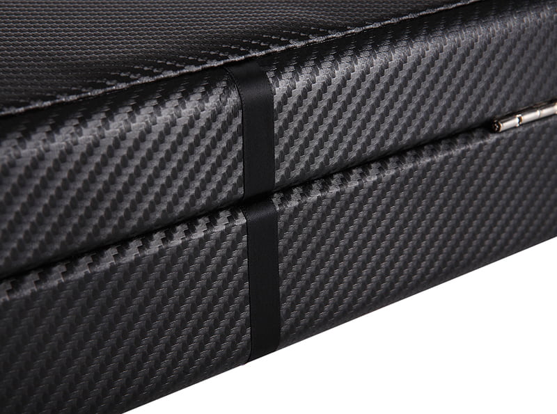 Close-up of black carbon fiber finish on watch storage case exterior